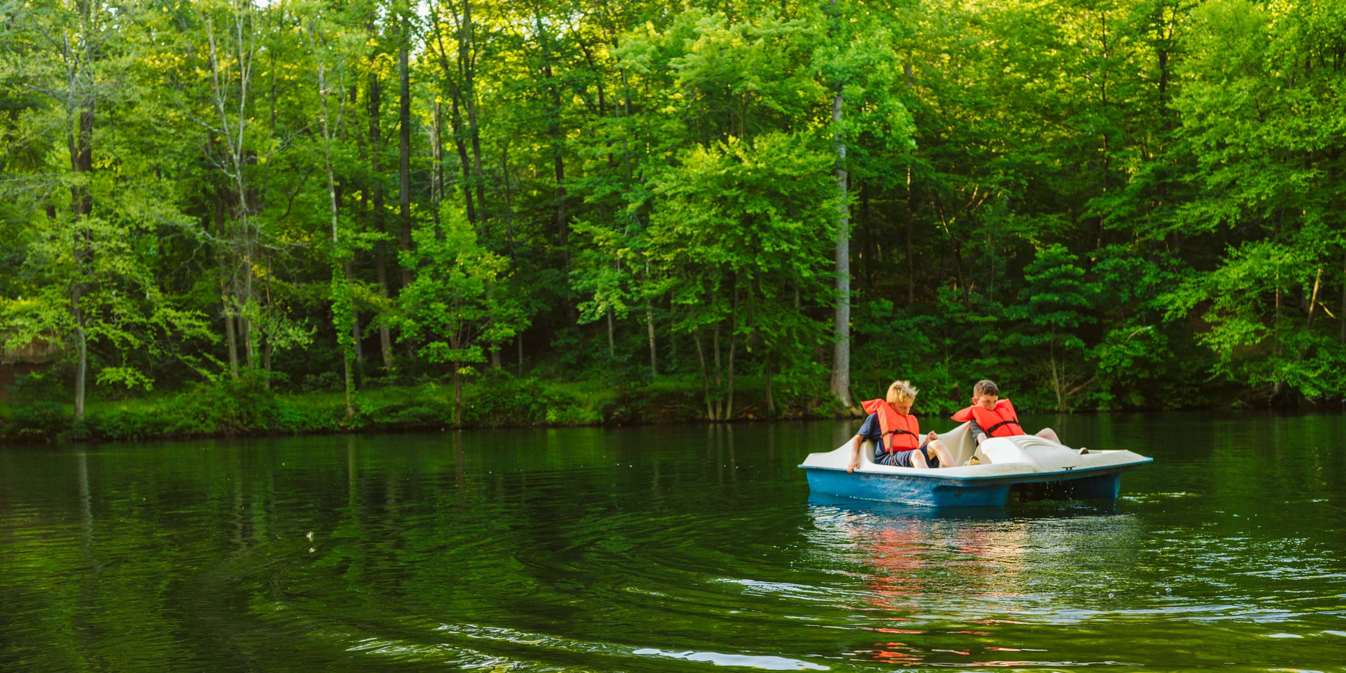 Two campers boating on lake