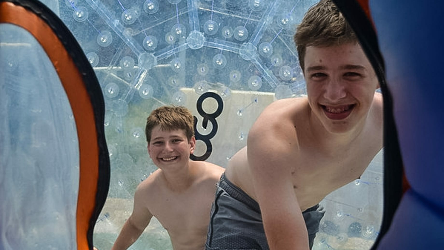 Boys in giant inflatable bubble