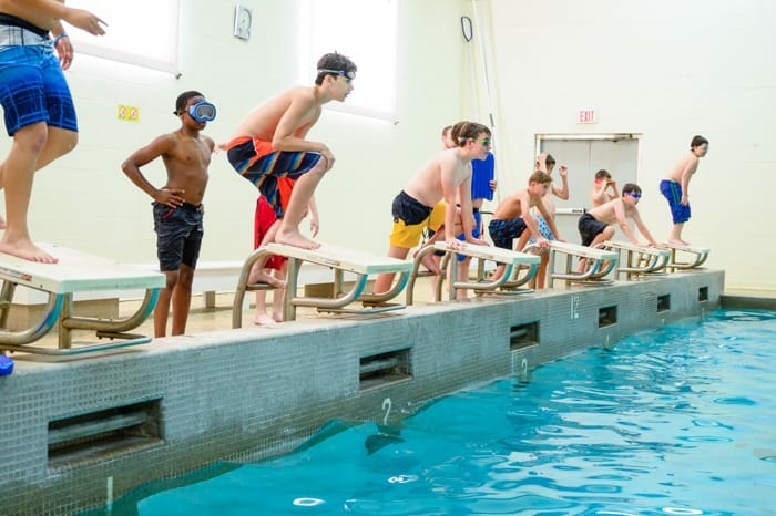 Kids diving into pool