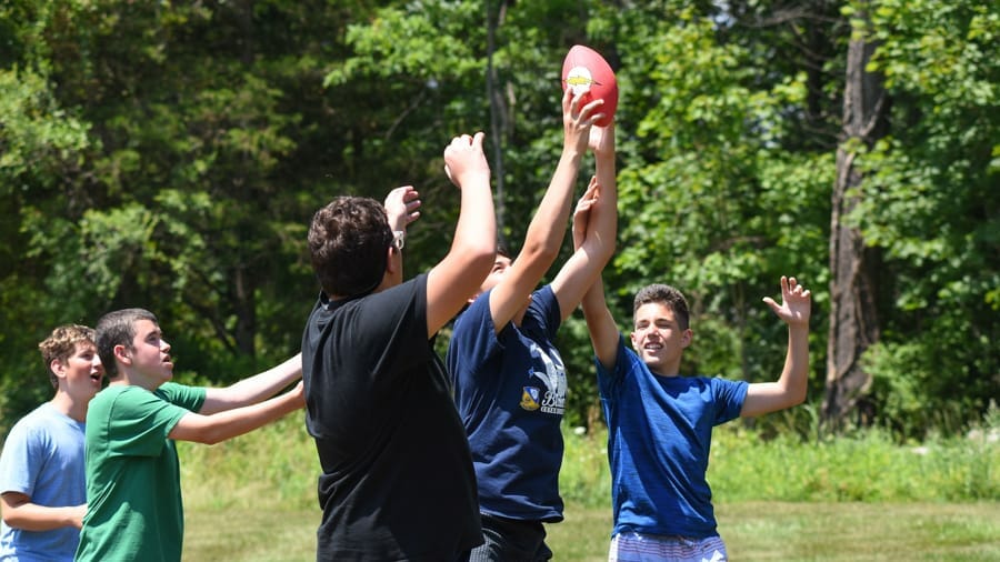 Campers playing football