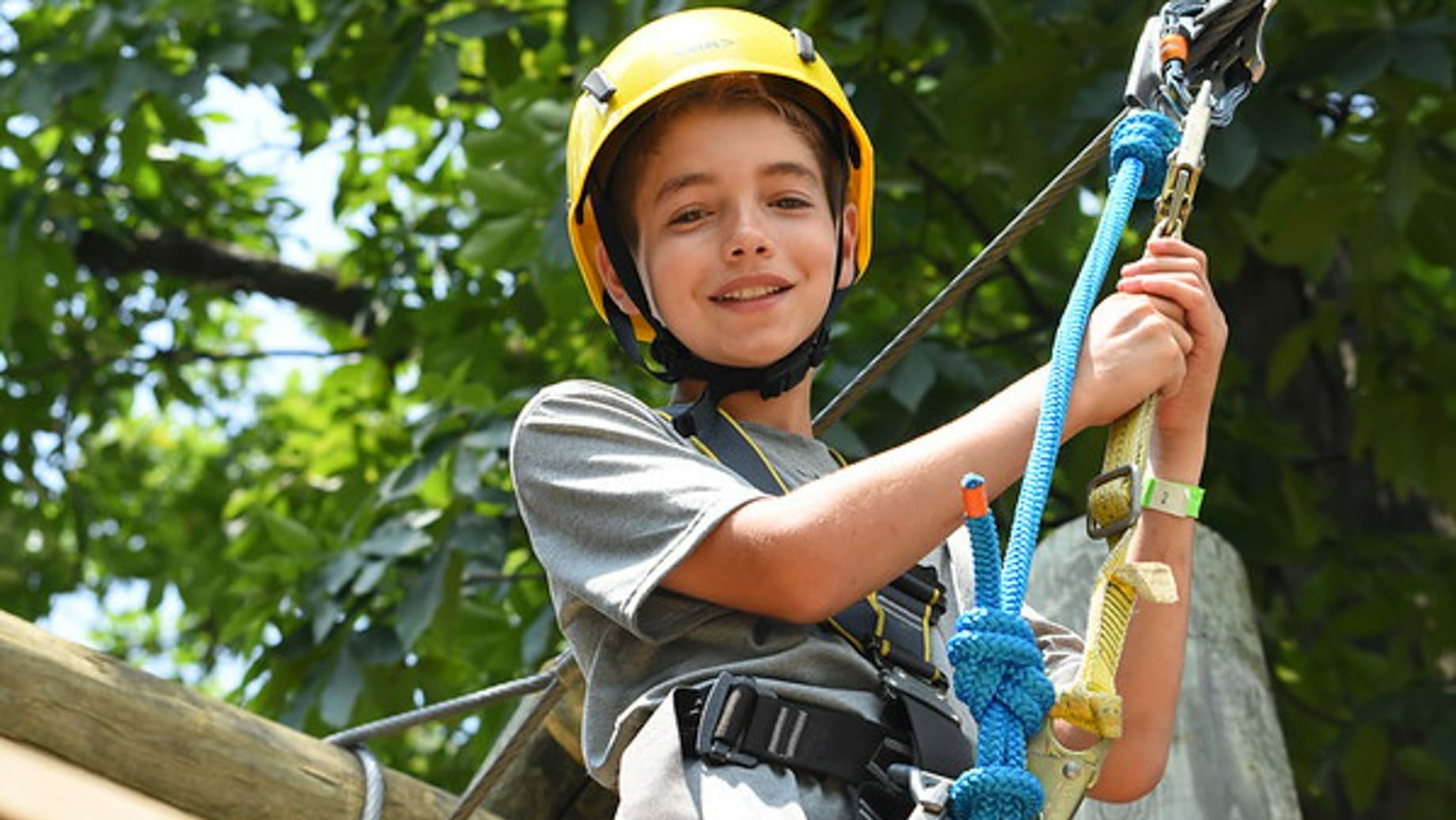 Camper on a high ropes course