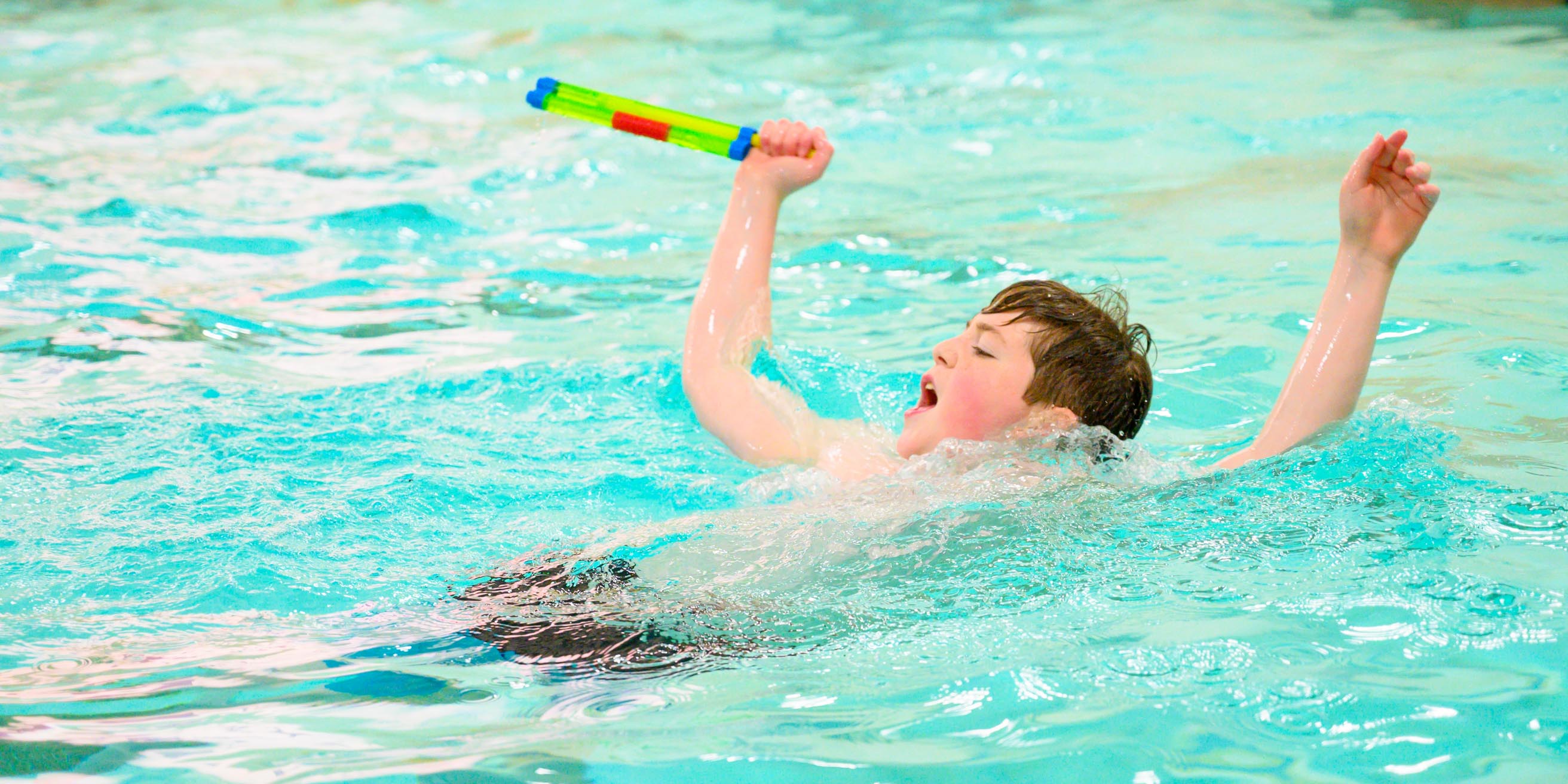 Boy swimming in pool