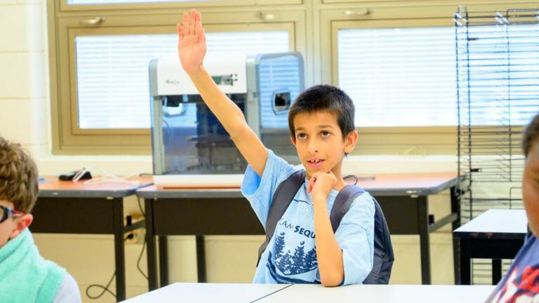 Camper raising his hand