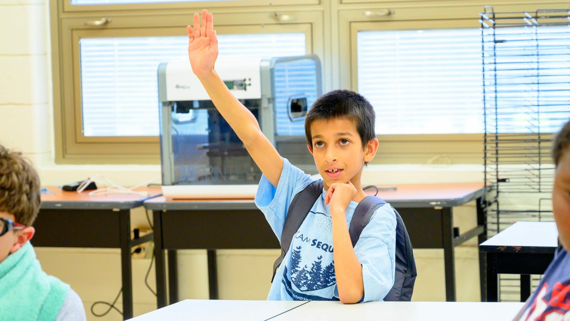 Camper raising his hand