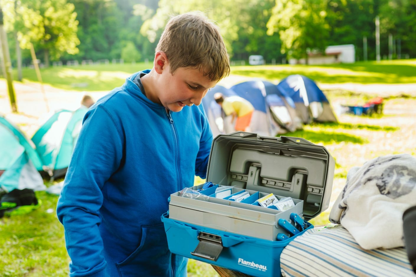 Camper looking at gear on a rustic retreat