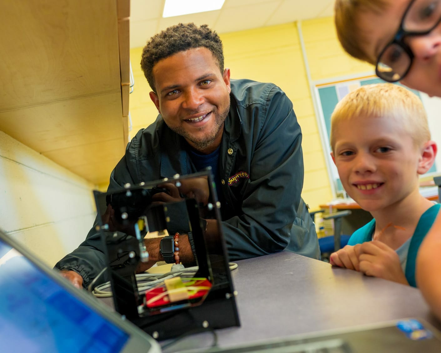 Staff with kids building robots
