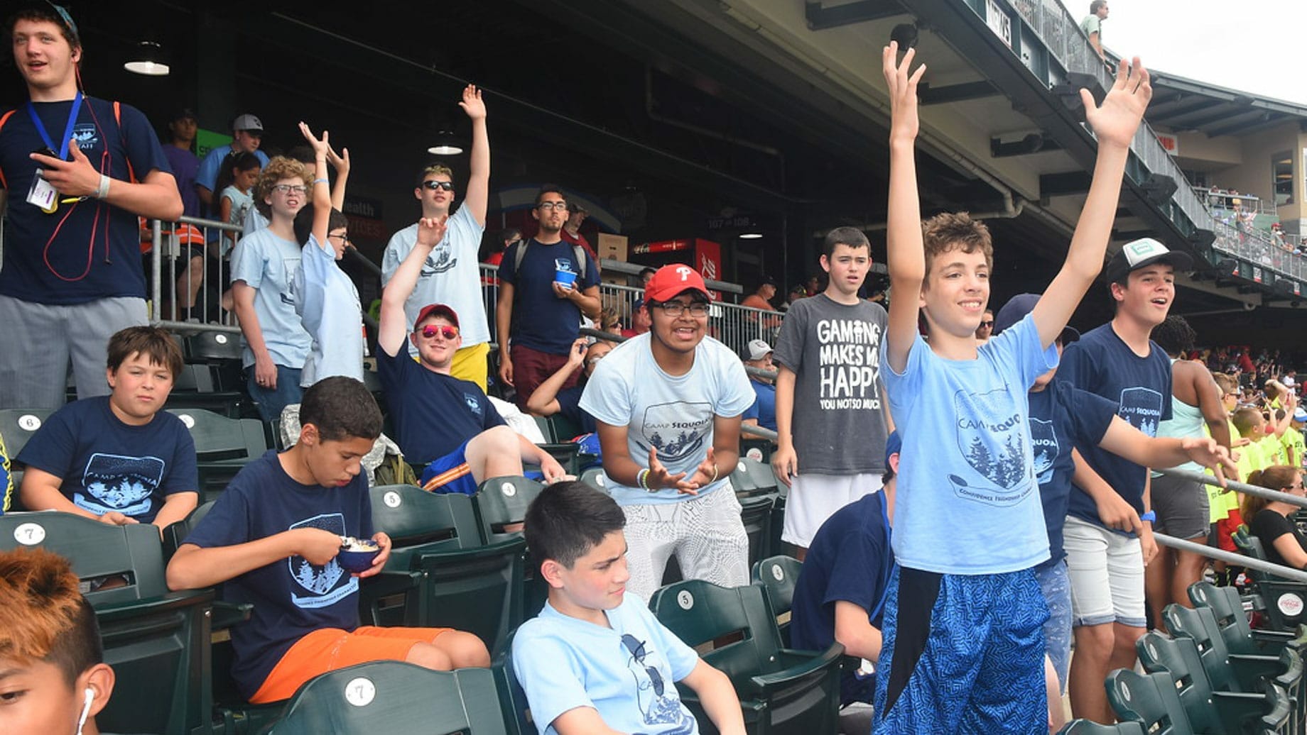 Campers cheering at a baseball game