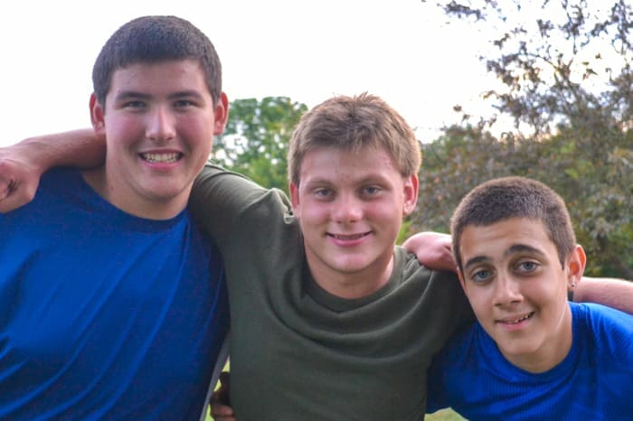 Three boys smiling