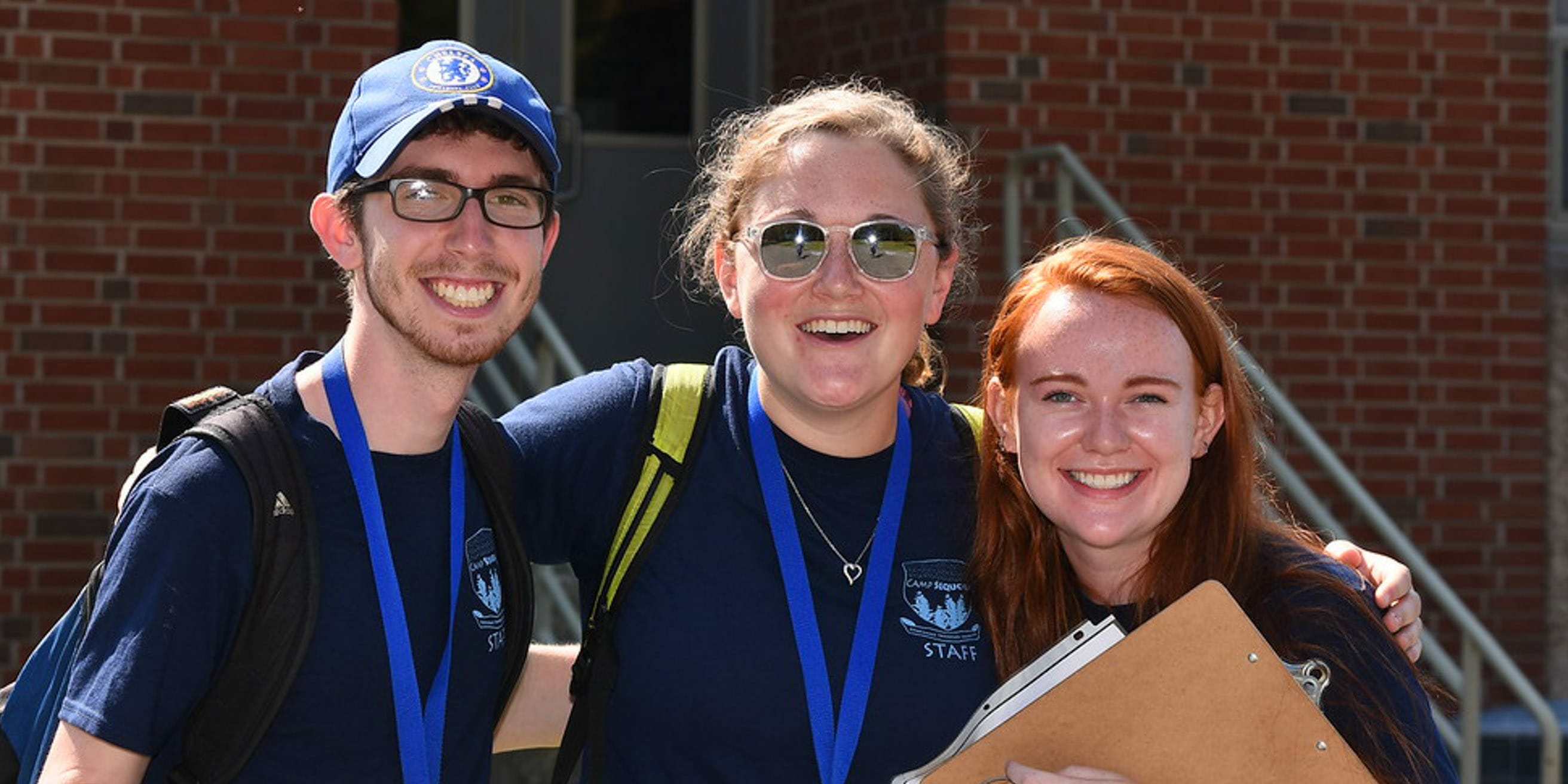 Three staff members smiling