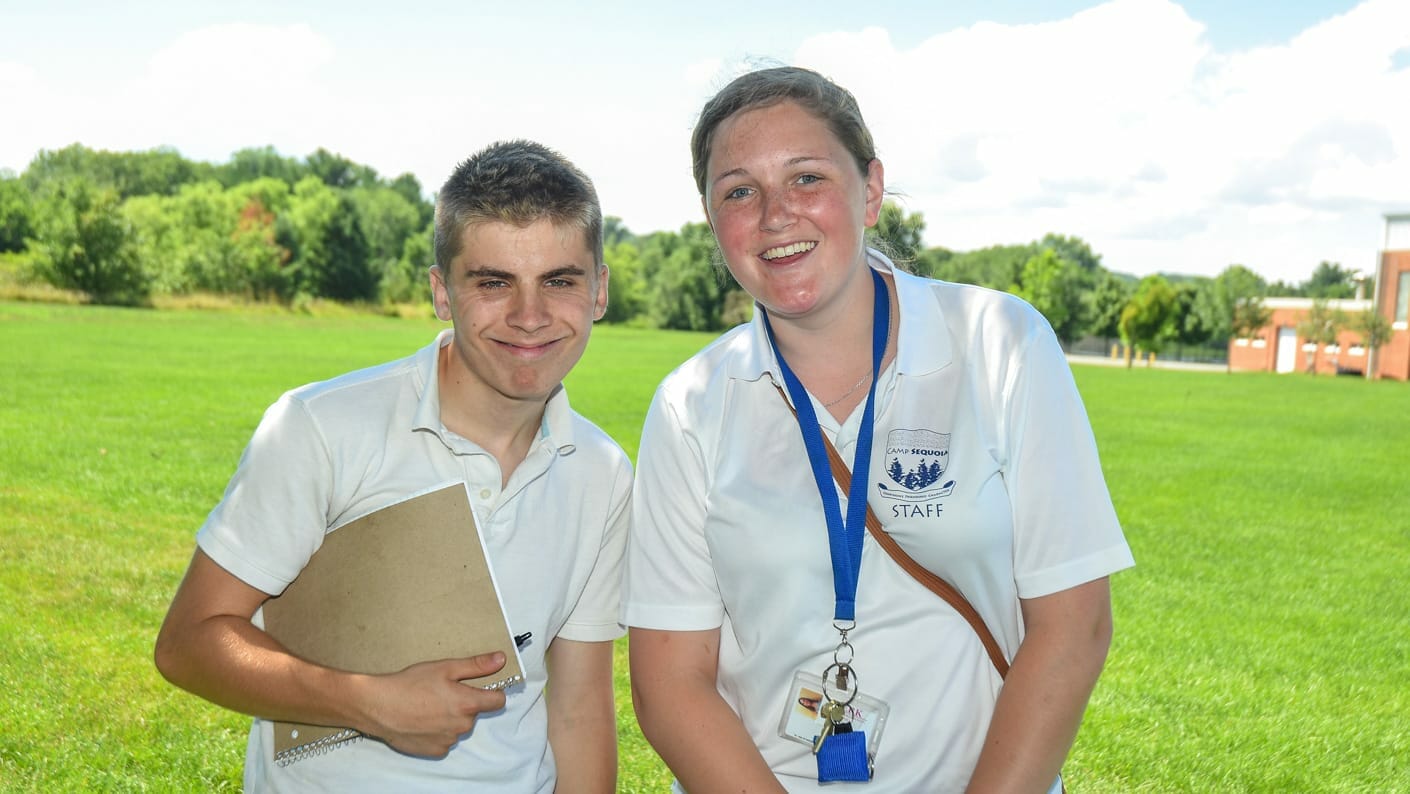 Two Sequoia staff members on the field with notebooks